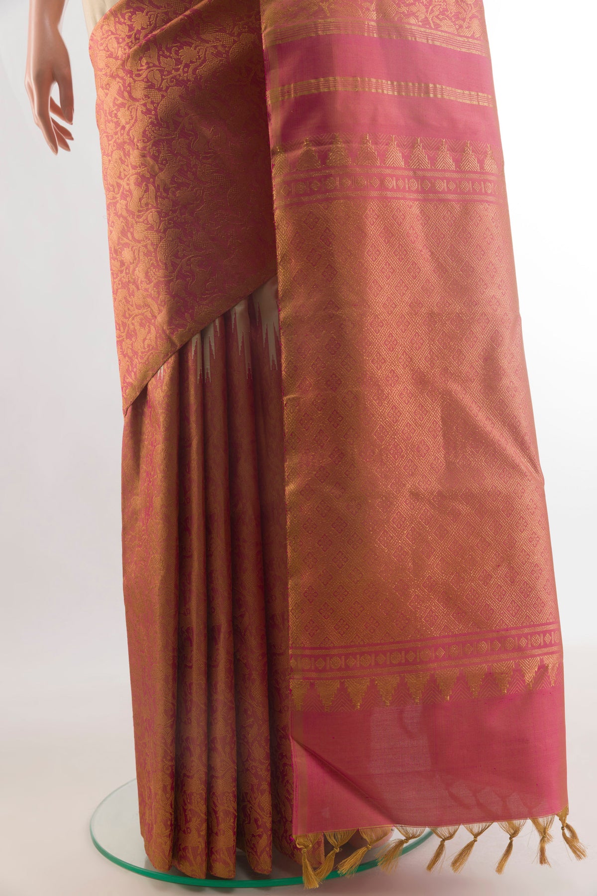 Pleats and pallu of Pure Silk Beige Kanchipuram Saree with Plain Body and Temple Border. 