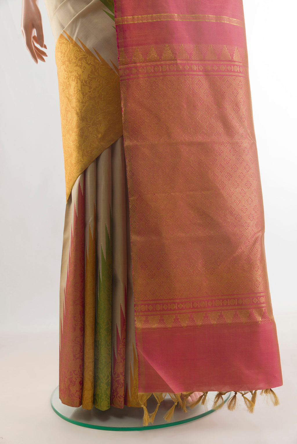 Pleats and pallu of Pure Silk Beige Kanchipuram Saree with Plain Body and Temple Border. 