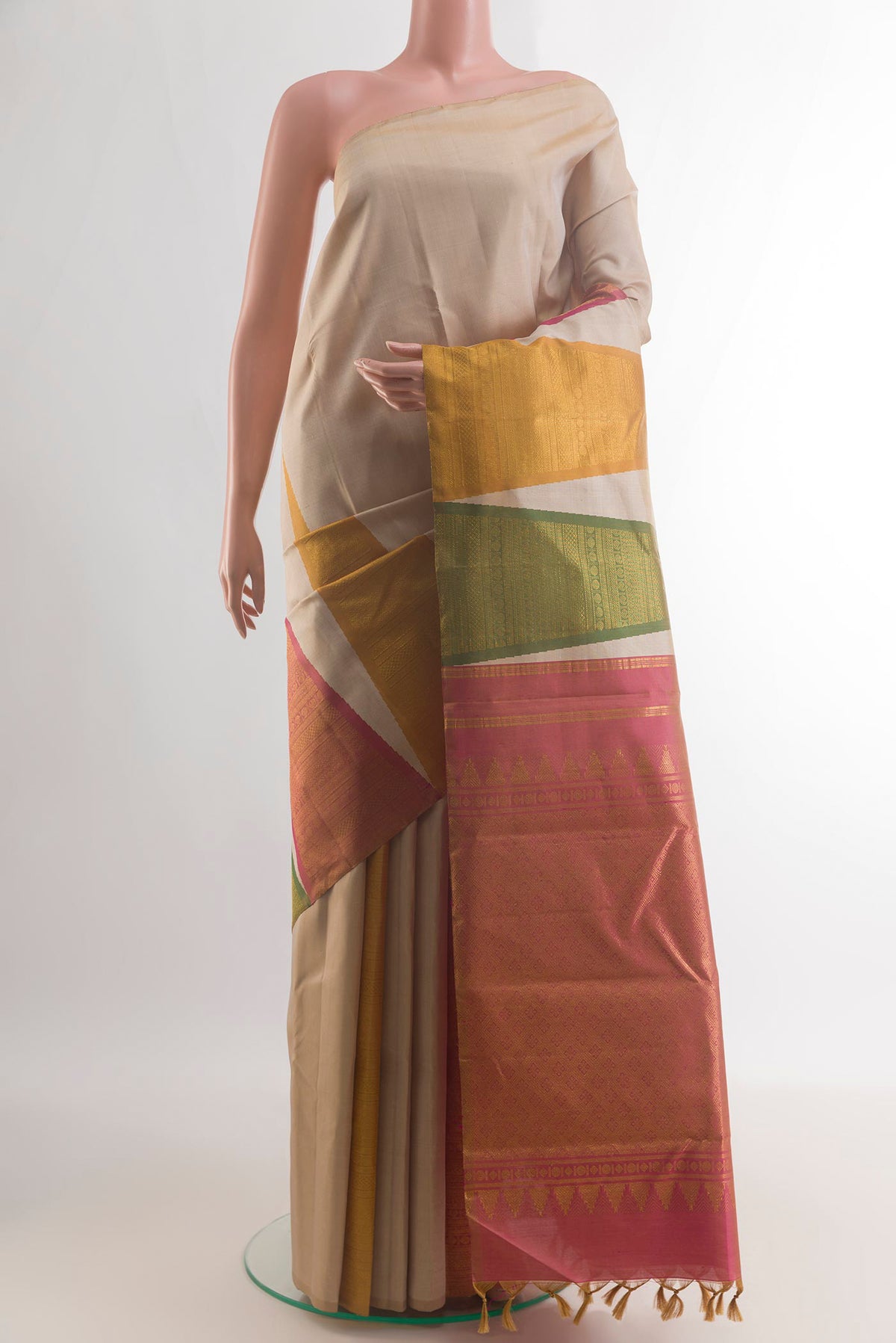 Pure Silk Cream Kanchipuram Saree with Plain Body and Temple Border.  displayed on a mannequin