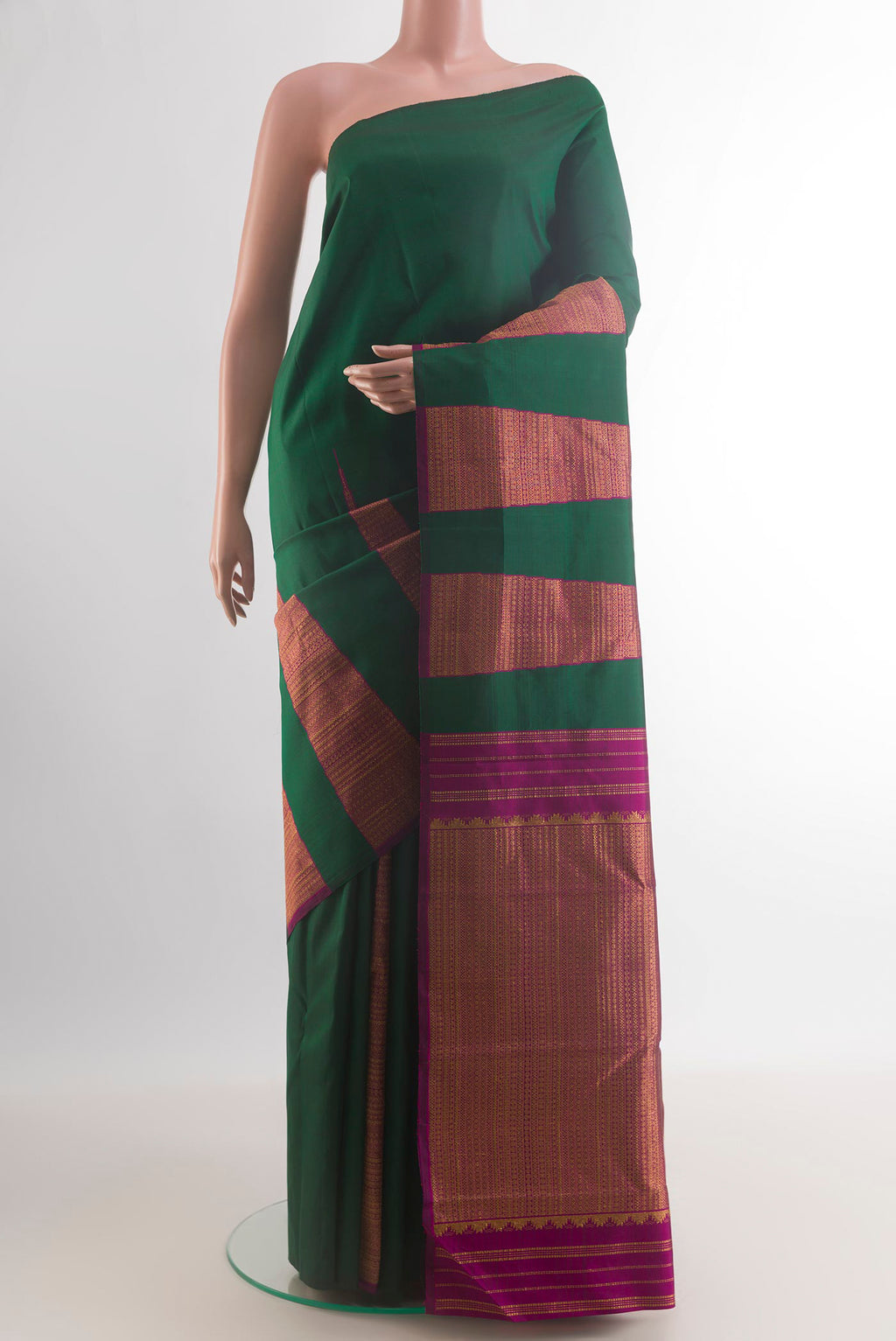 Pure Silk Green Kanchipuram Saree with Plain Body and Temple Border.  displayed on a mannequin
