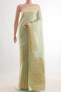 Pure Silk Cream Kanjivaram Saree with Plain Body and Zari Border.  displayed on a mannequin