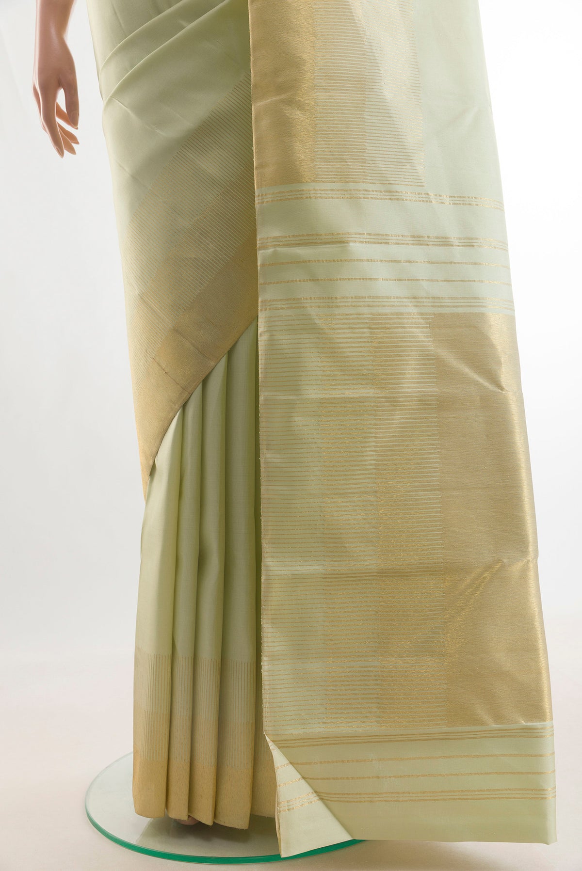 Pleats and pallu of Pure Silk Cream Kanjivaram Saree with Plain Body and Zari Border. 