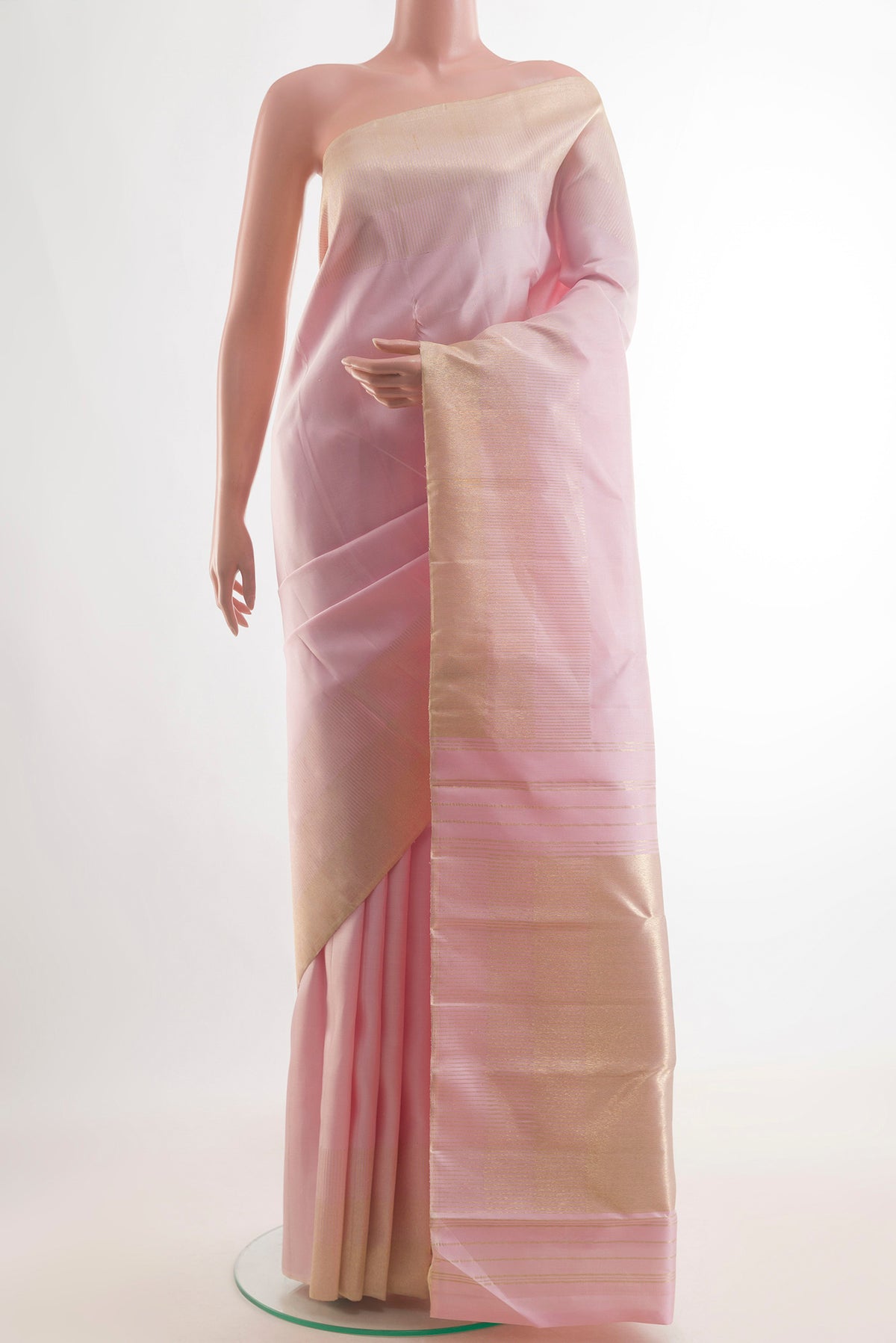 Pure Silk Rose pink Kanjivaram Saree with Plain Body and Zari Border.  displayed on a mannequin