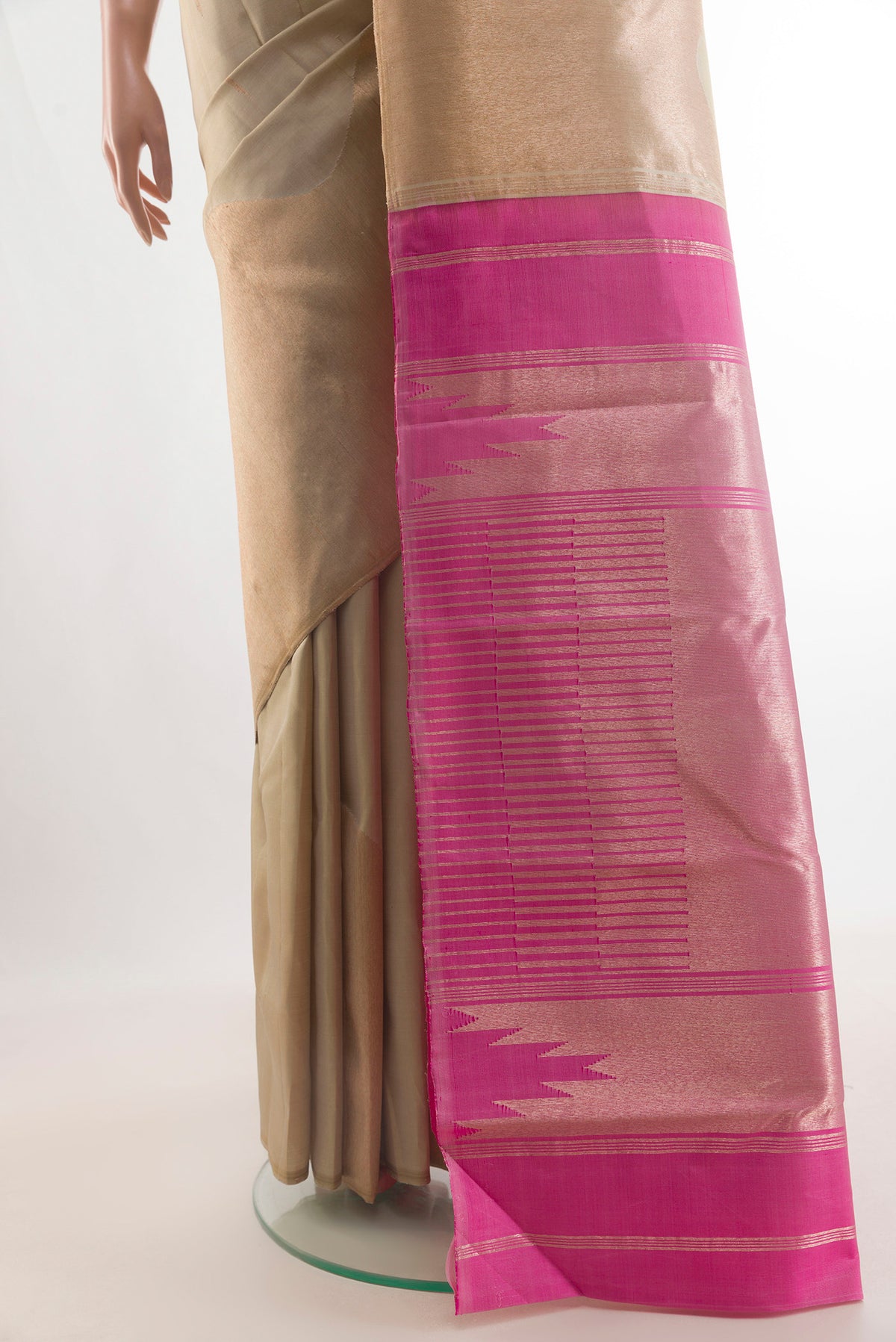 Pleats and pallu of Pure Silk Beige Kanchipuram Saree with Zari Butta on the body and Zari Border. 