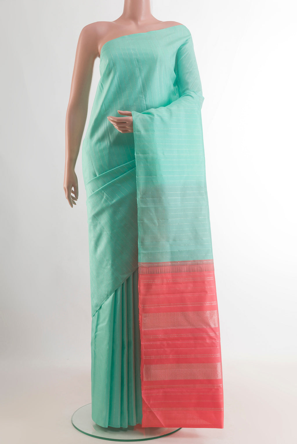 Pure Silk Sea Green Kanjivaram Saree with Stripes on the body and Without Border.  displayed on a mannequin