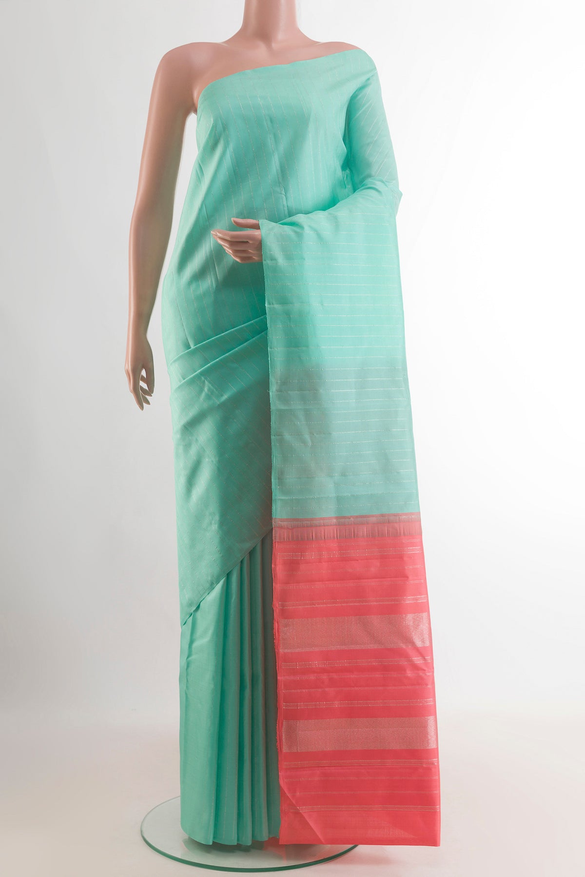 Pure Silk Sea Green Kanjivaram Saree with Stripes on the body and Without Border.  displayed on a mannequin