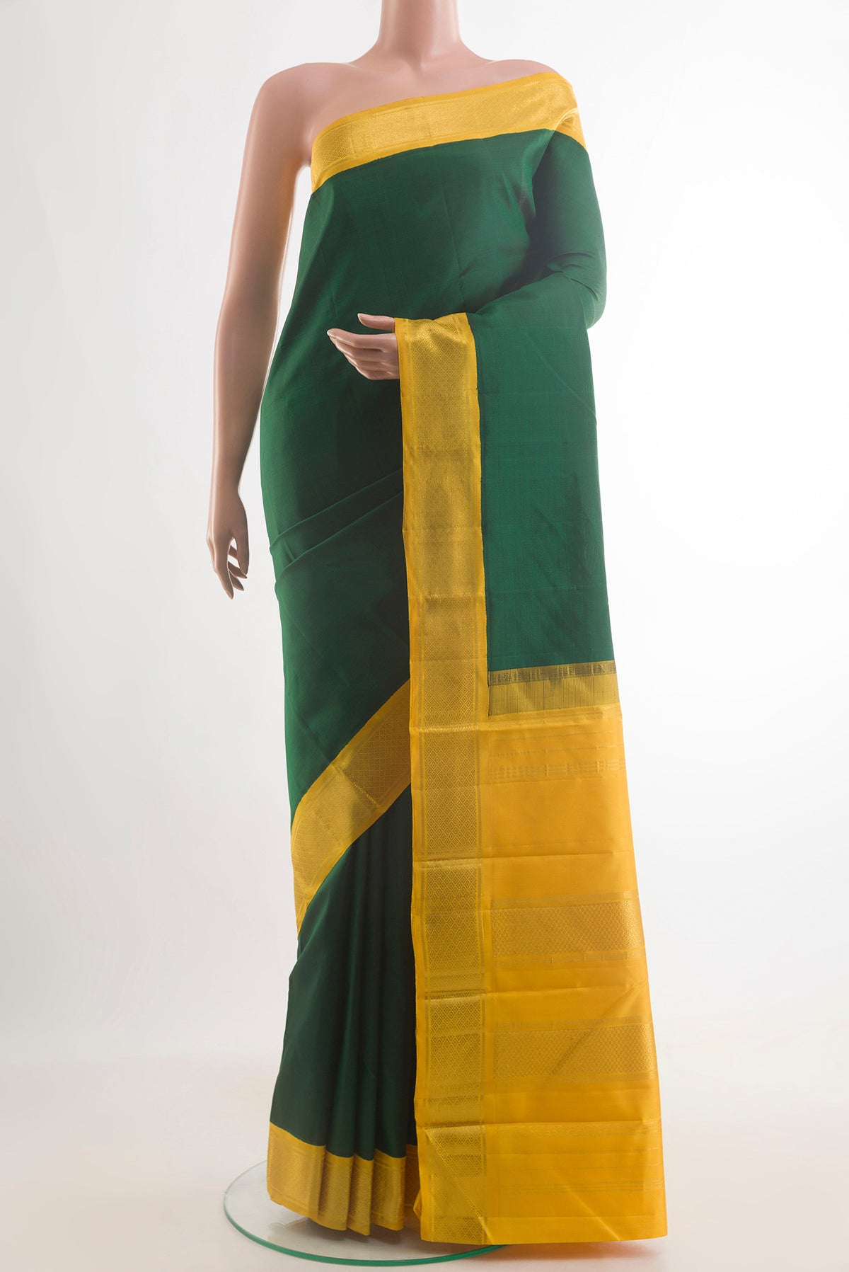 Pure Silk Bottle Green Kanjivaram Saree with Plain Body and Zari Border.  displayed on a mannequin