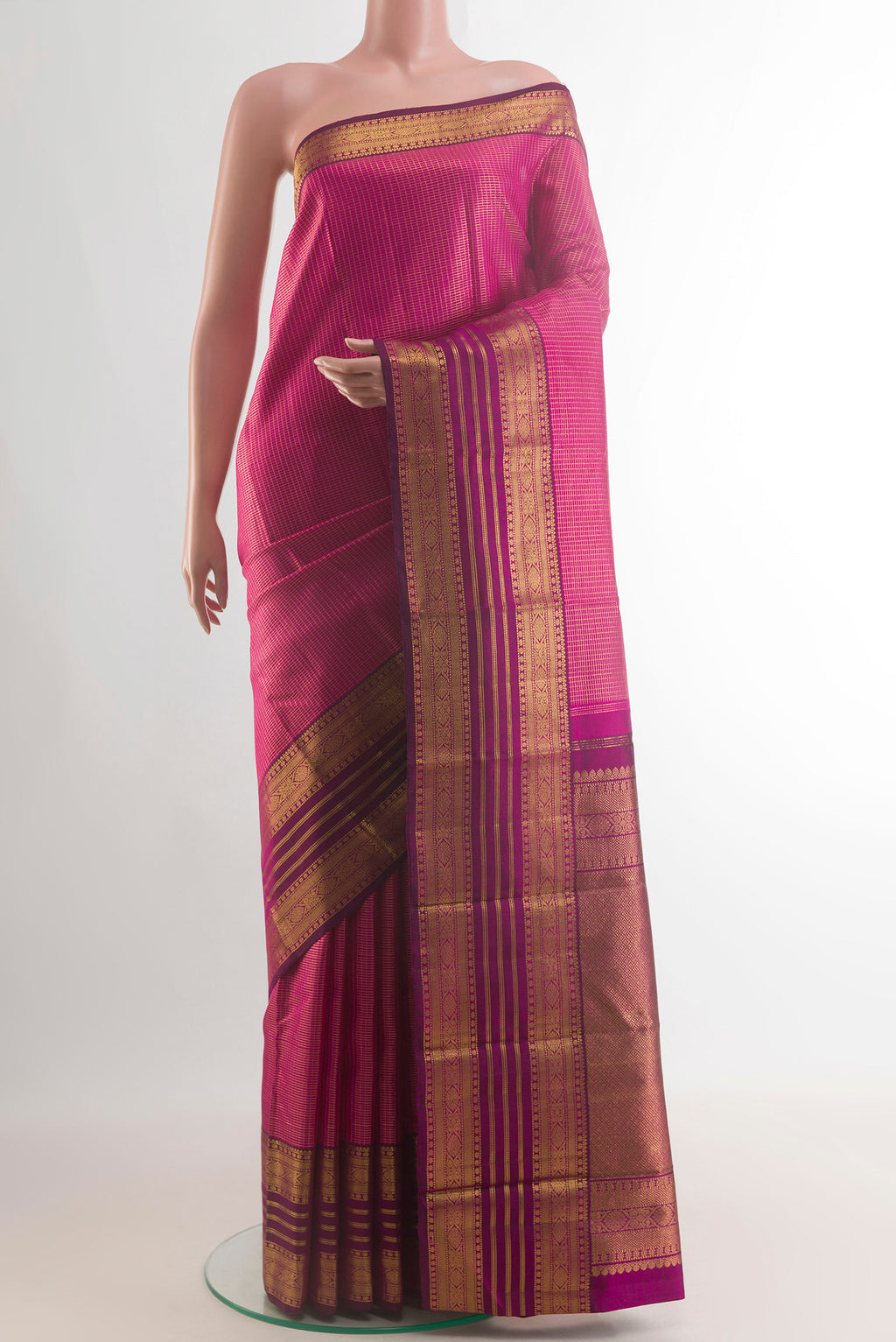 Pure Silk Rani Pink Kanjivaram Saree with Checked design on the body and Zari Border.  displayed on a mannequin
