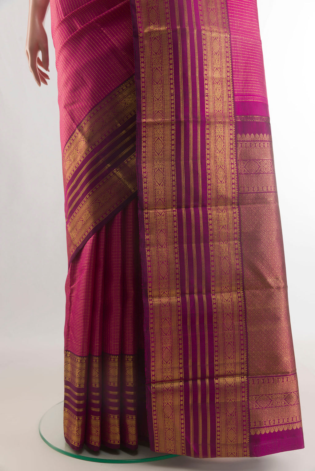 Pleats and pallu of Pure Silk Rani Pink Kanjivaram Saree with Checked design on the body and Zari Border. 