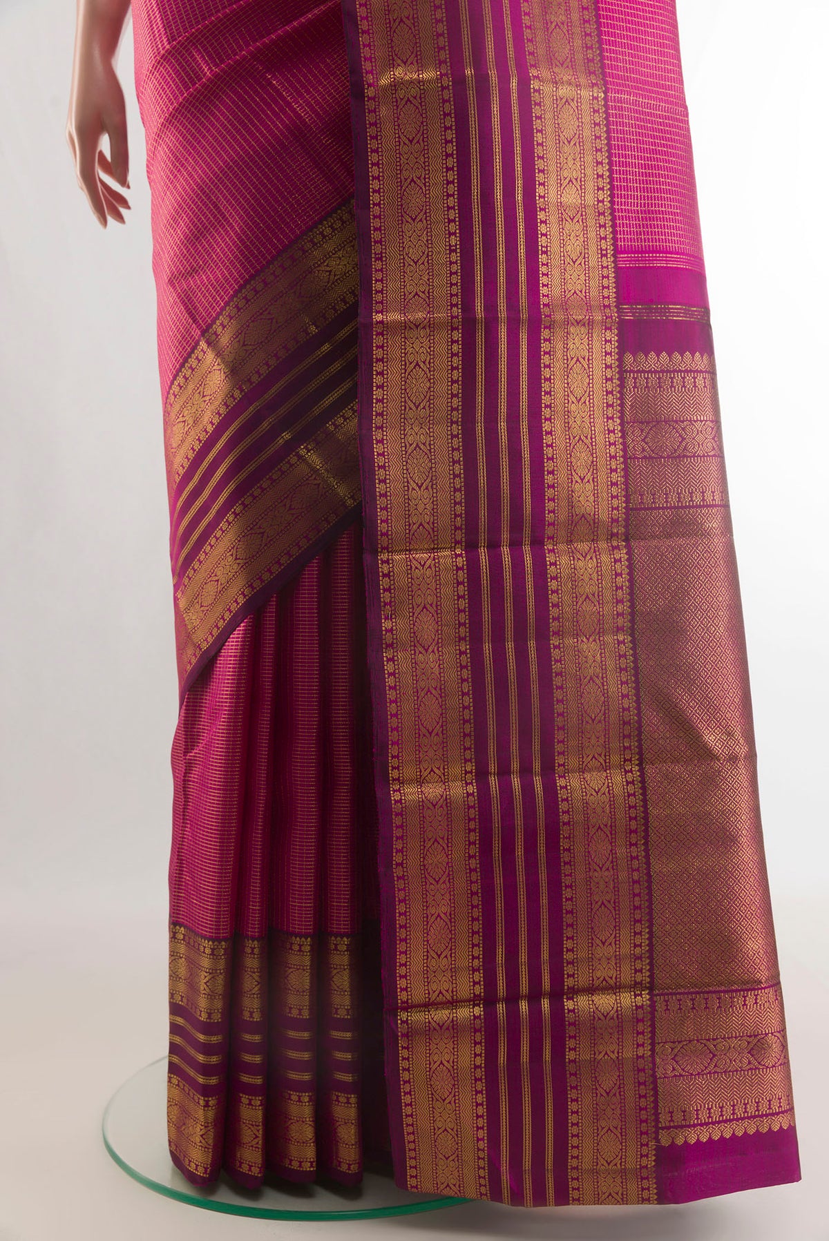 Pleats and pallu of Pure Silk Rani Pink Kanjivaram Saree with Checked design on the body and Zari Border. 