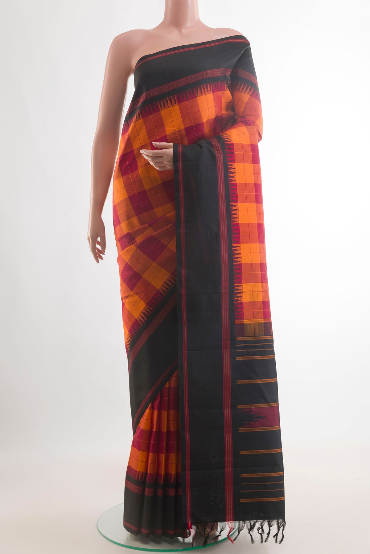 Pure Silk Orange Kanjivaram Saree with Checked design on the body and Plain Border.  displayed on a mannequin