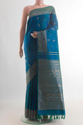 Pure Silk Blue Kanchipuram Saree with Zari Butta on the body and Zari Border.  displayed on a mannequin