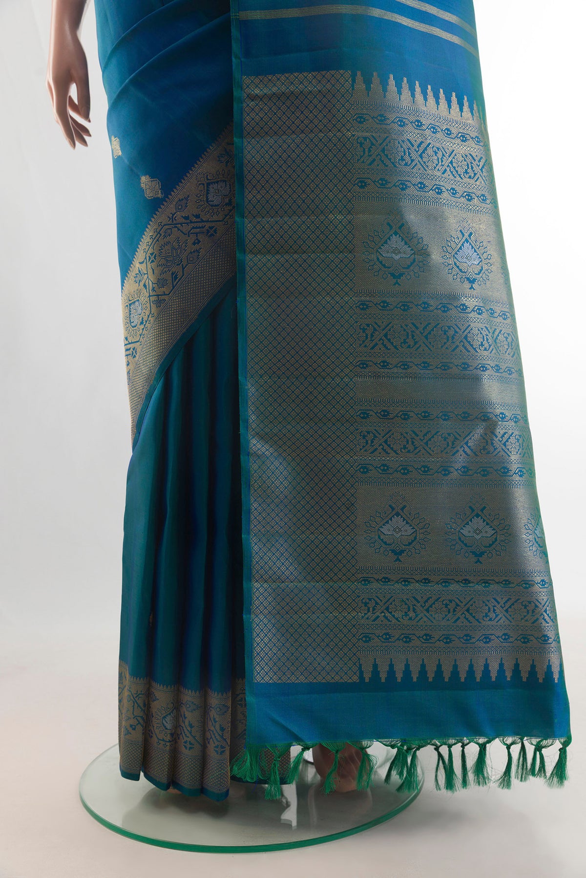 Pleats and pallu of Pure Silk Blue Kanchipuram Saree with Zari Butta on the body and Zari Border. 