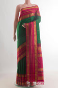 Pure Silk Green Kanchipuram Saree with Zari Butta on the body and Zari Border.  displayed on a mannequin
