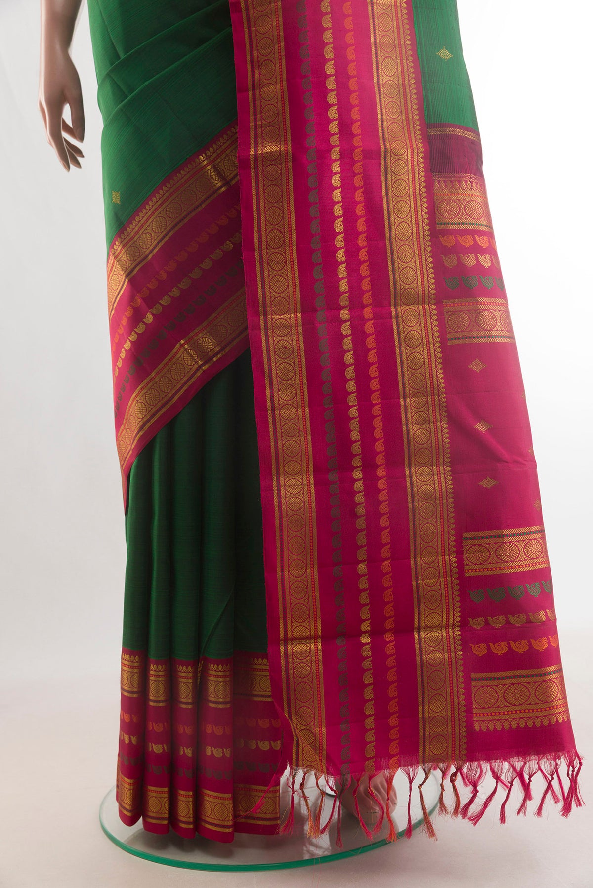 Pleats and pallu of Pure Silk Green Kanchipuram Saree with Zari Butta on the body and Zari Border. 