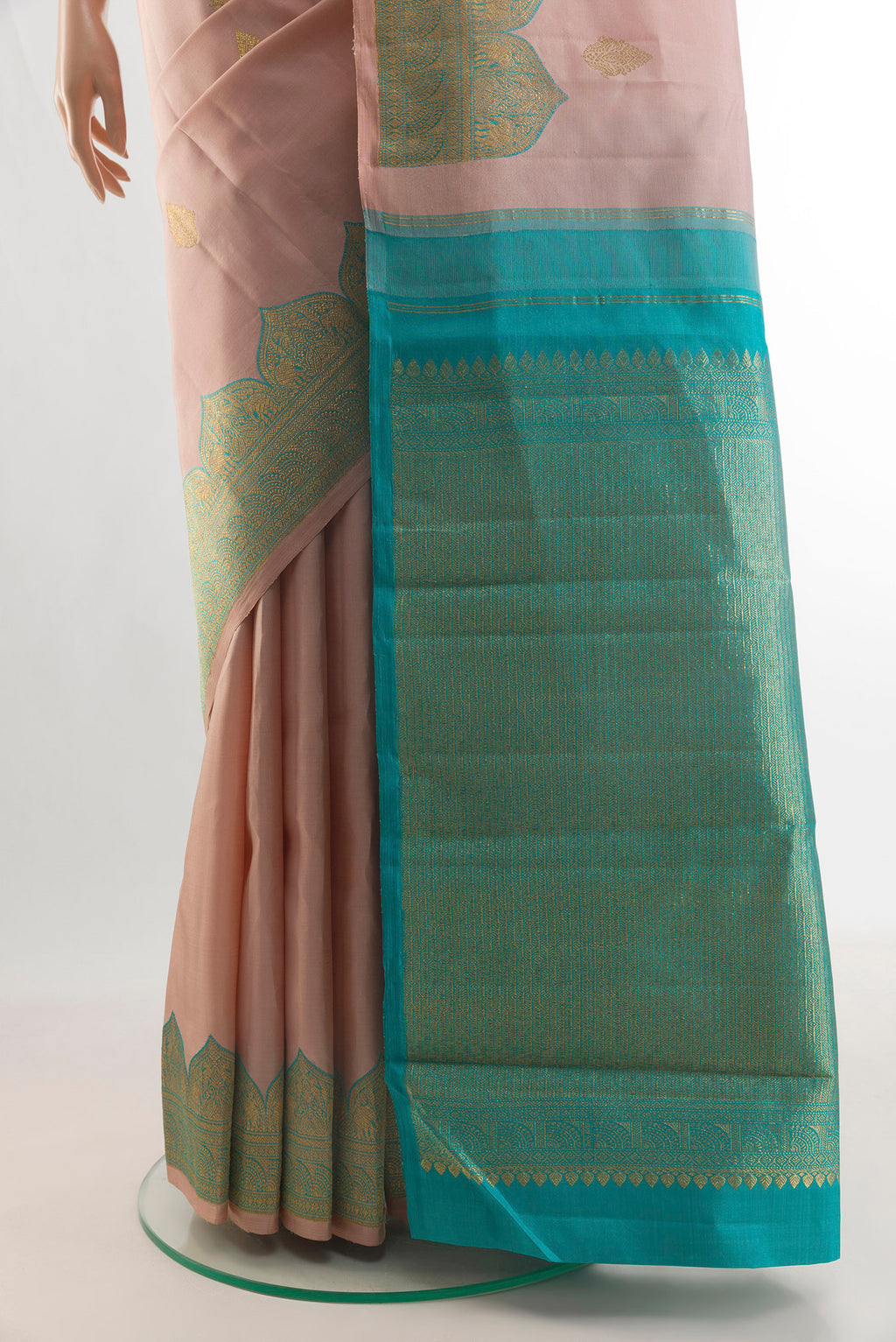 Pleats and pallu of Pure Silk Rose Gold Kanjivaram Saree with Zari Butta on the body and Zari Border. 