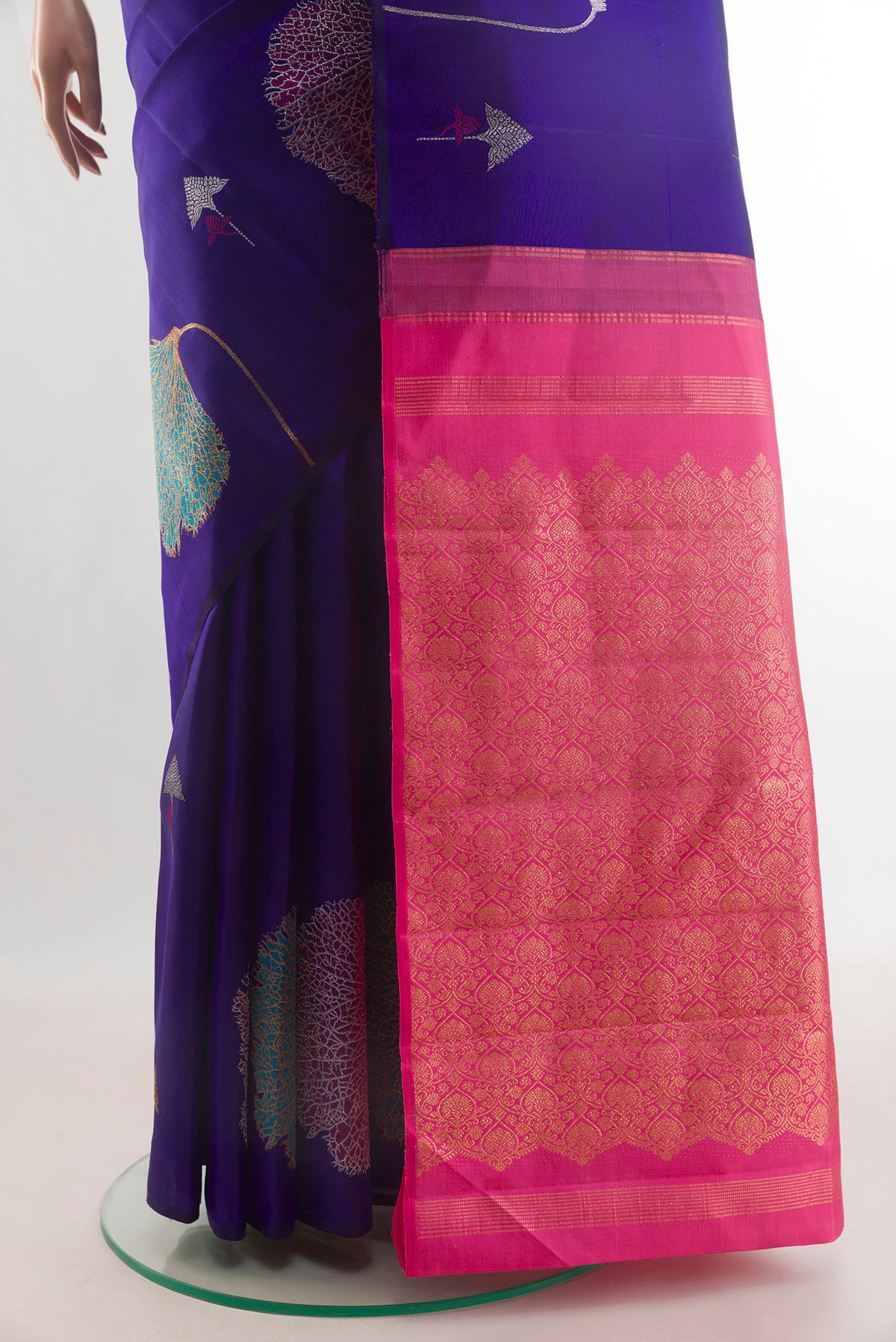 Pleats and pallu of Pure Silk Blue Kanjivaram Saree with Zari And Thread Butta on the body and Without Border. 
