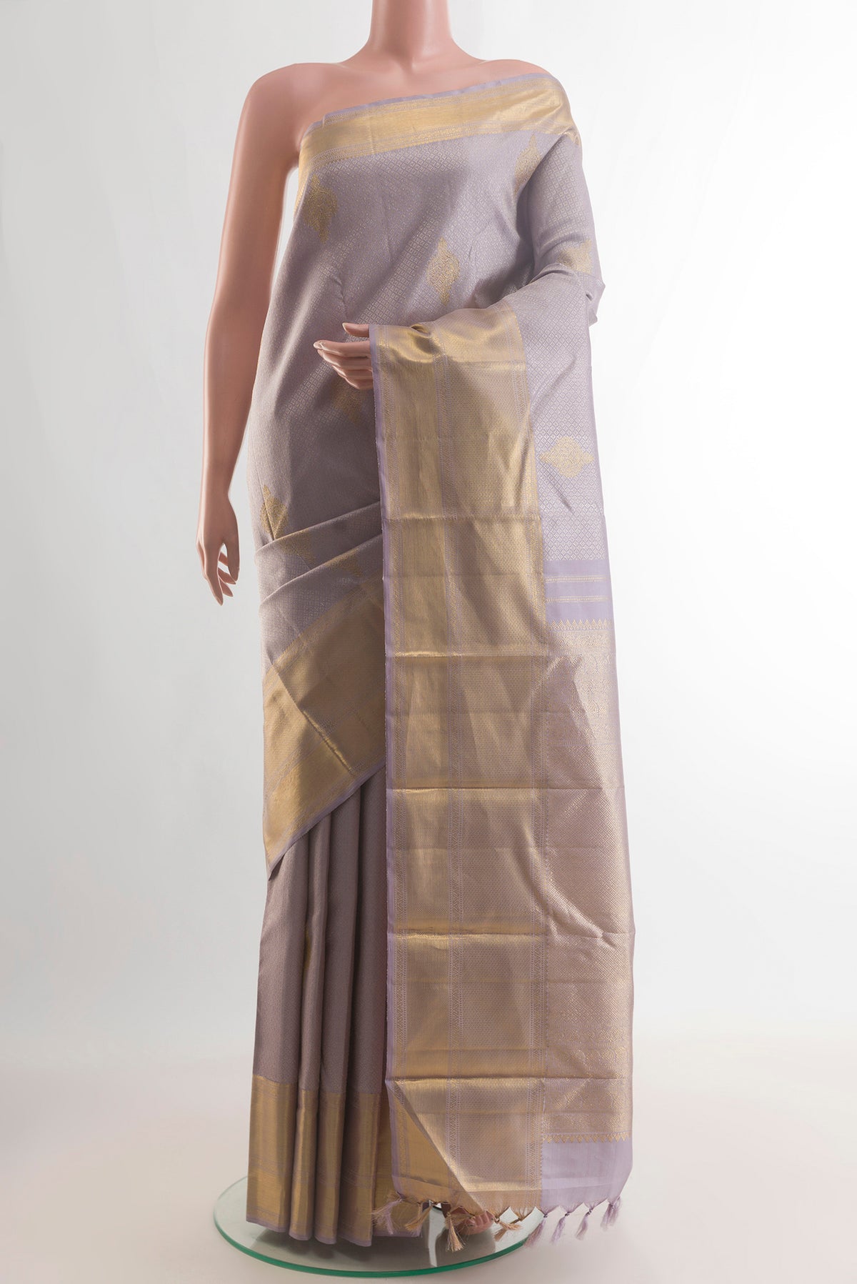 Pure Silk Lavender Kanjivaram Saree with Jacquard With Zari Butta on the body and Zari Border.  displayed on a mannequin