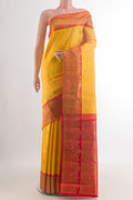 Pure Silk Yellow Kanjivaram Saree with Zari Butta on the body and Zari Border.  displayed on a mannequin