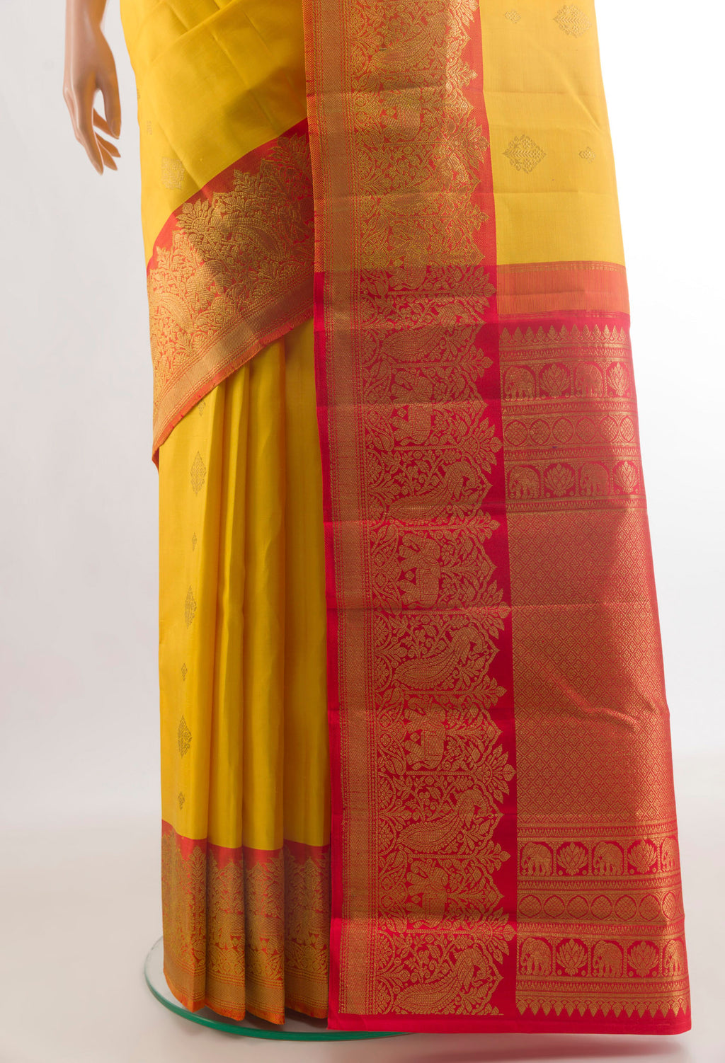Pleats and pallu of Pure Silk Yellow Kanjivaram Saree with Zari Butta on the body and Zari Border. 