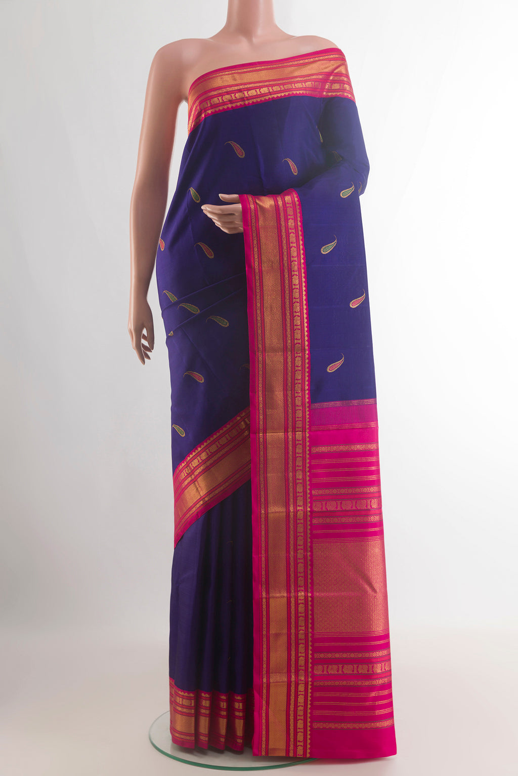 Pure Silk Dark Blue Kanjivaram Saree with Zari And Thread Butta on the body and Zari Border.  displayed on a mannequin