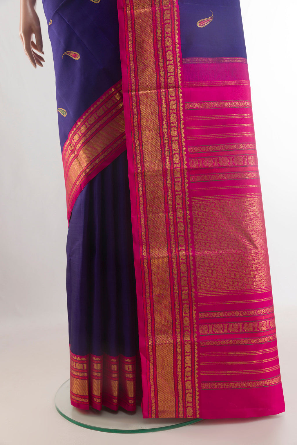 Pleats and pallu of Pure Silk Dark Blue Kanjivaram Saree with Zari And Thread Butta on the body and Zari Border. 