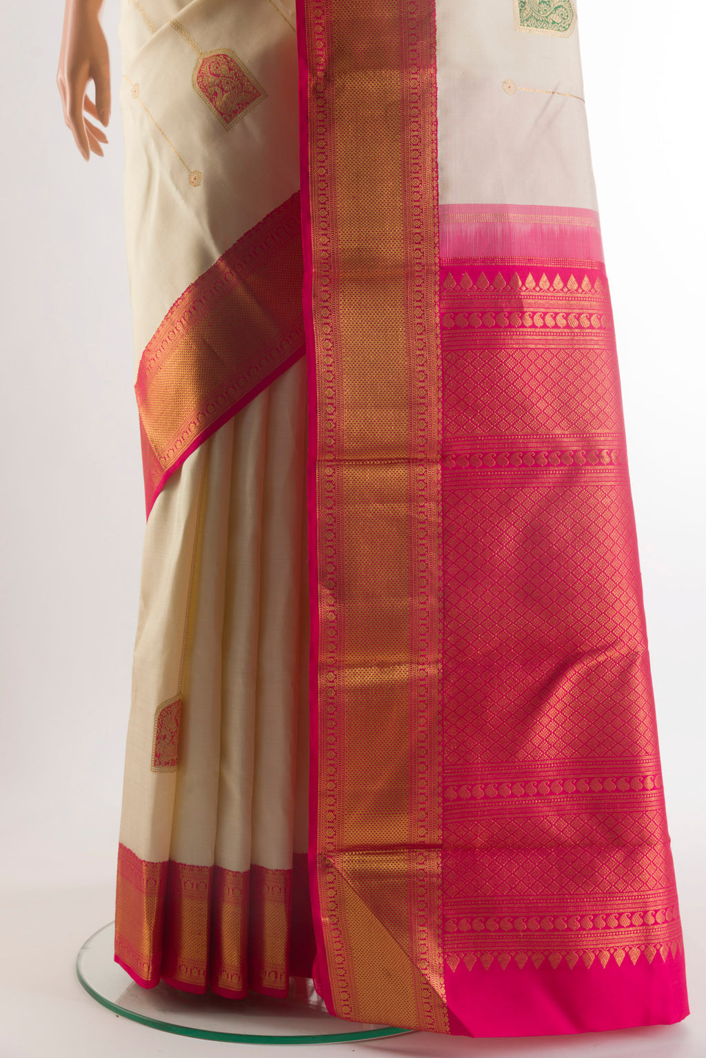 Pleats and pallu of Pure Silk Off White Kanchipuram Saree with Stripes on the body and Zari Border. 