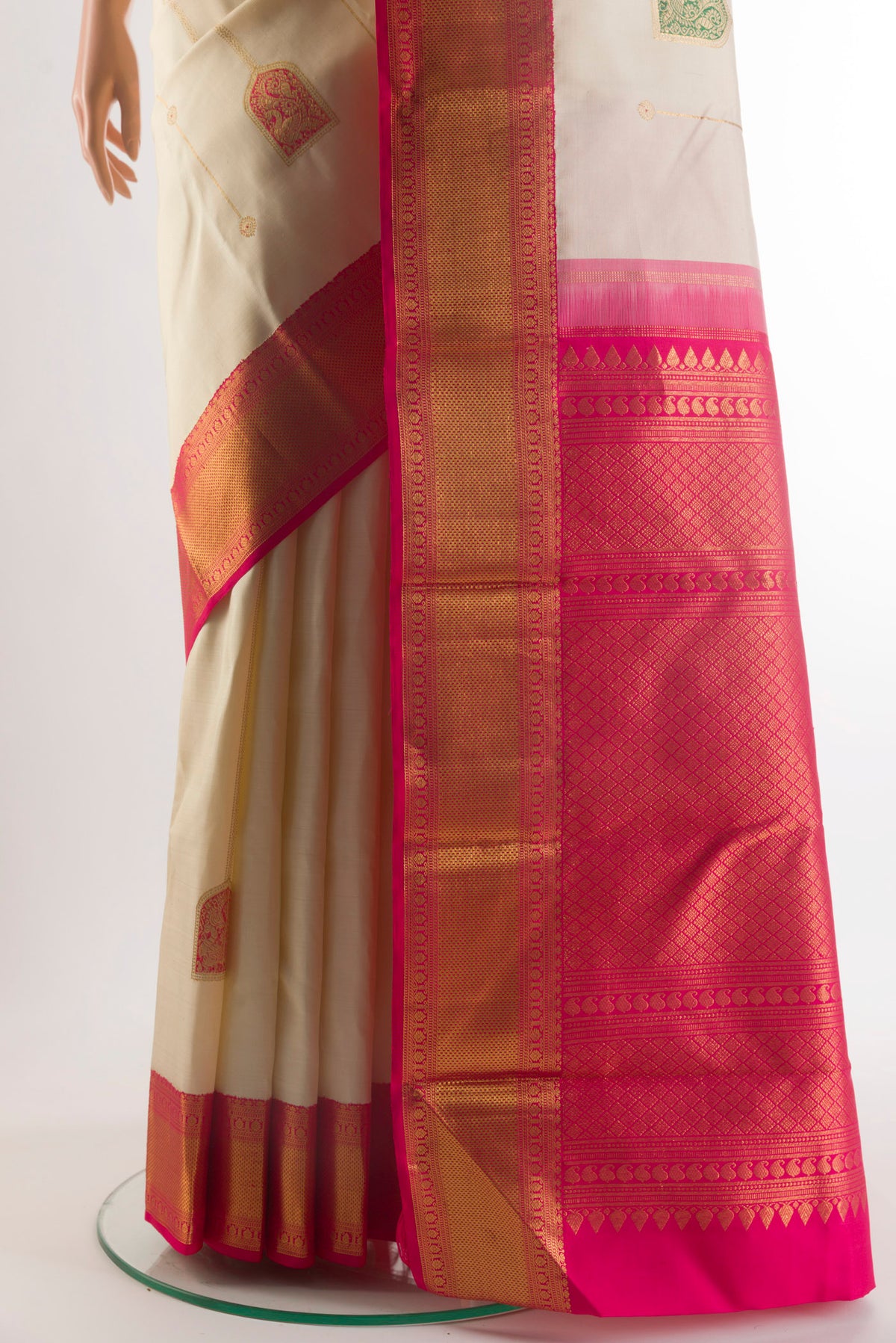 Pleats and pallu of Pure Silk Off White Kanchipuram Saree with Stripes on the body and Zari Border. 