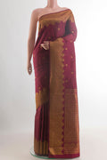 Pure Silk Maroon Kanjivaram Saree with Zari Butta on the body and Zari Border.  displayed on a mannequin
