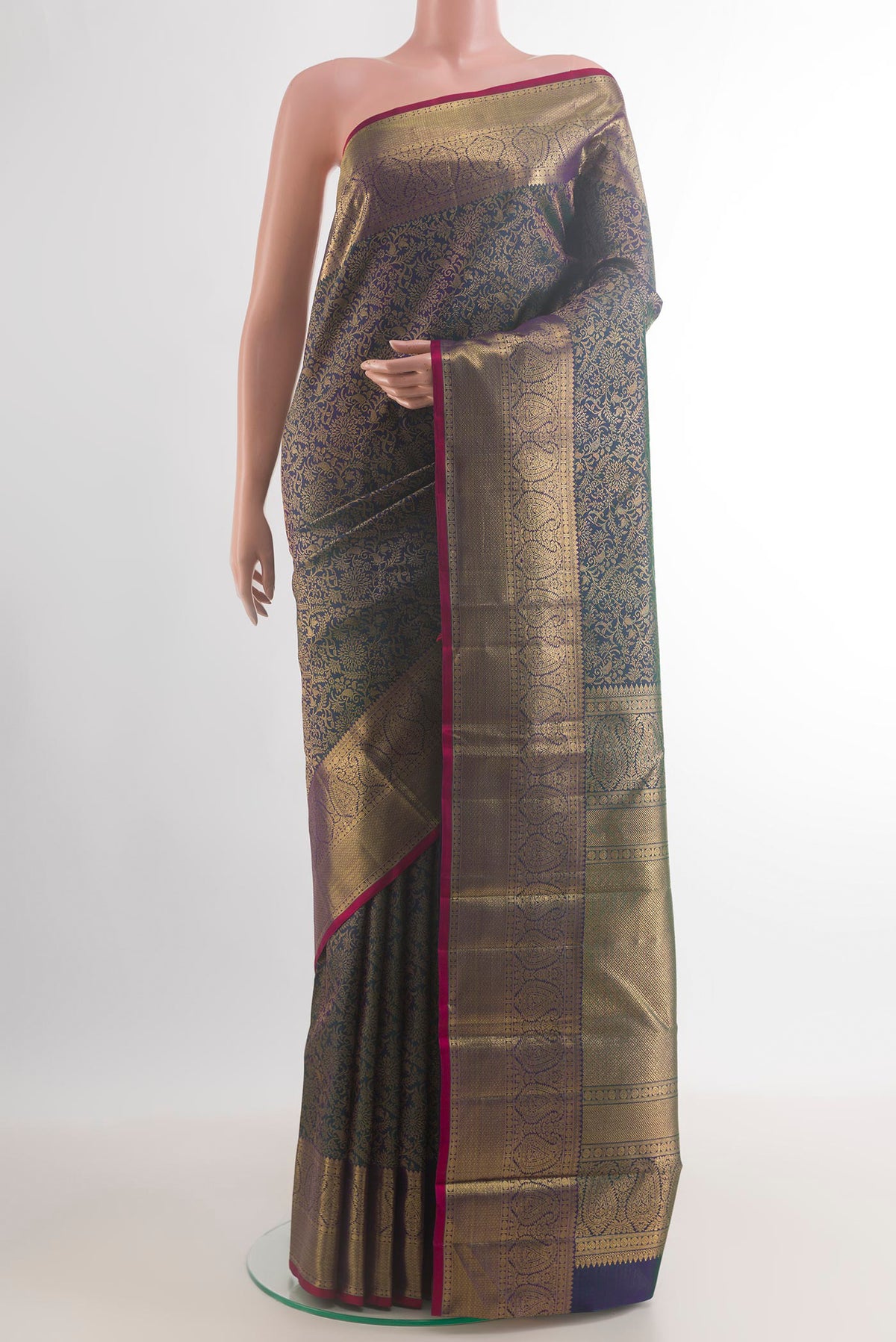 Pure Silk Bottle Green Kanchipuram Saree with Zari Brocade on the body and Zari Border.  displayed on a mannequin