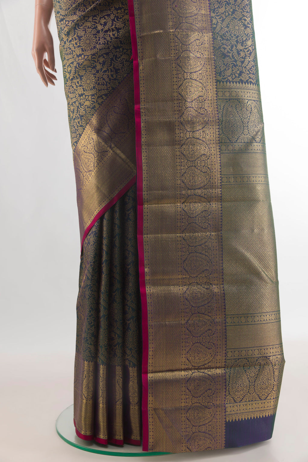 Pleats and pallu of Pure Silk Bottle Green Kanchipuram Saree with Zari Brocade on the body and Zari Border. 