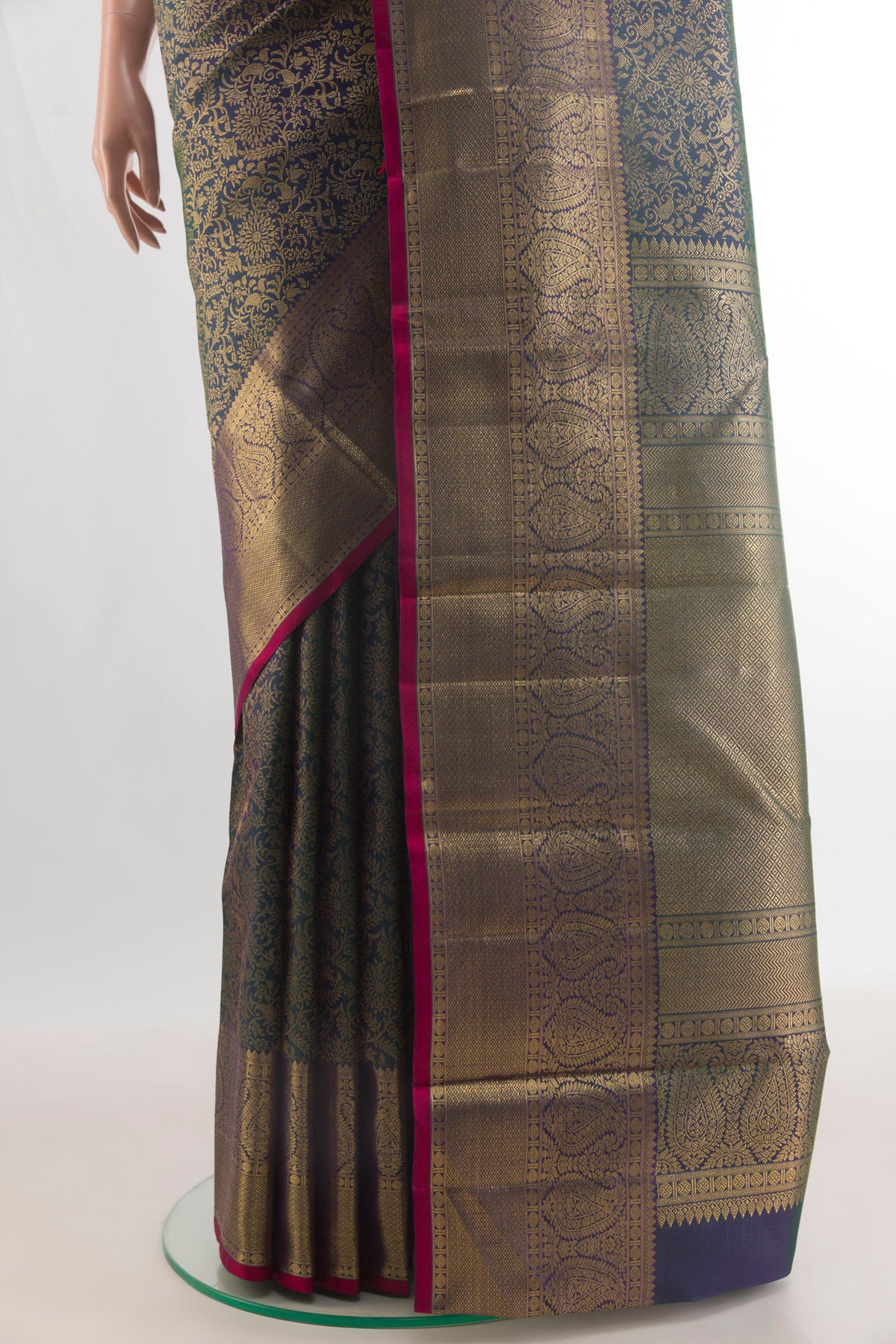 Pleats and pallu of Pure Silk Bottle Green Kanchipuram Saree with Zari Brocade on the body and Zari Border. 