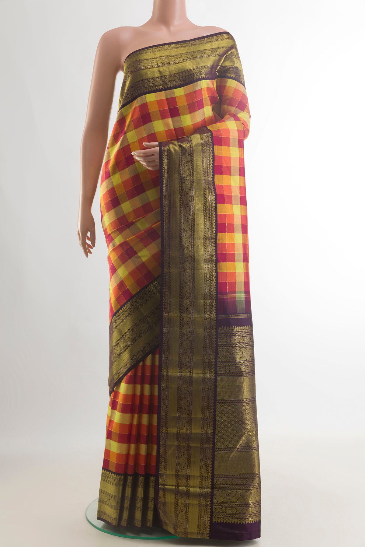 Pure Silk Multi Color Kanchipuram Saree with Checked design on the body and Zari Border.  displayed on a mannequin
