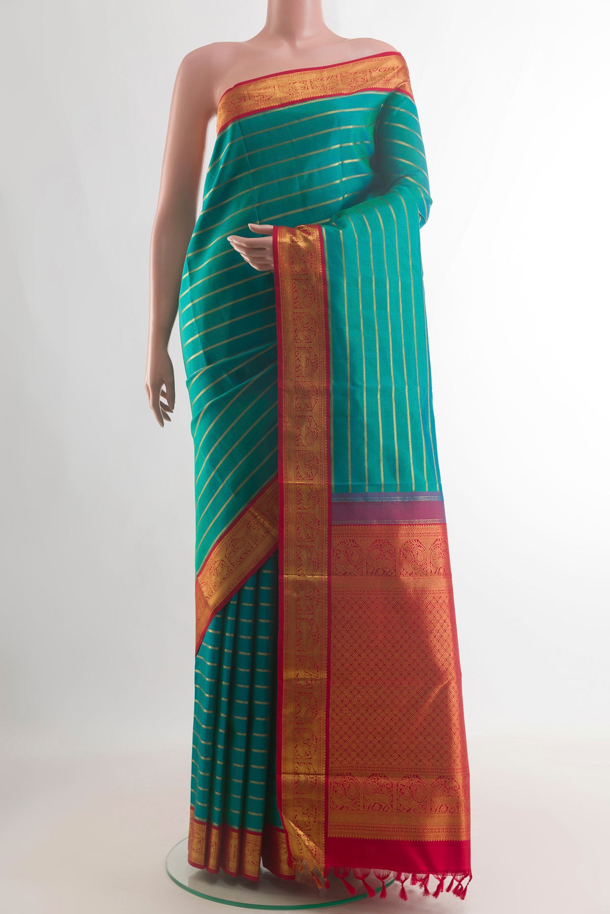 Pure Silk Sea Green Kanchipuram Saree with Stripes on the body and Zari Border.  displayed on a mannequin