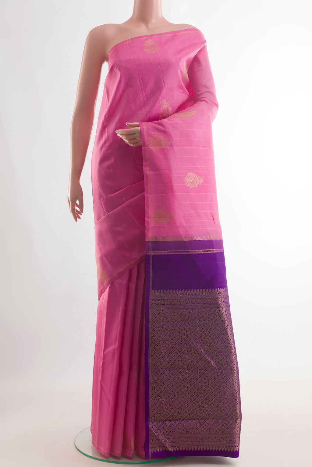 Pure Silk Pink Kanchipuram Saree with Zari Butta on the body and Zari Border.  displayed on a mannequin