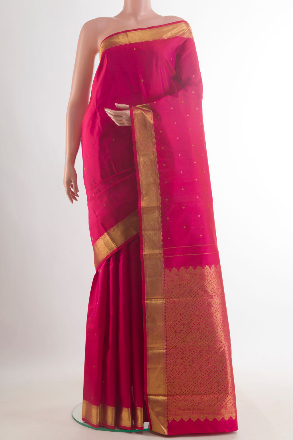 Pure Silk Pink Kanchipuram Saree with Zari Butta on the body and Zari Border.  displayed on a mannequin