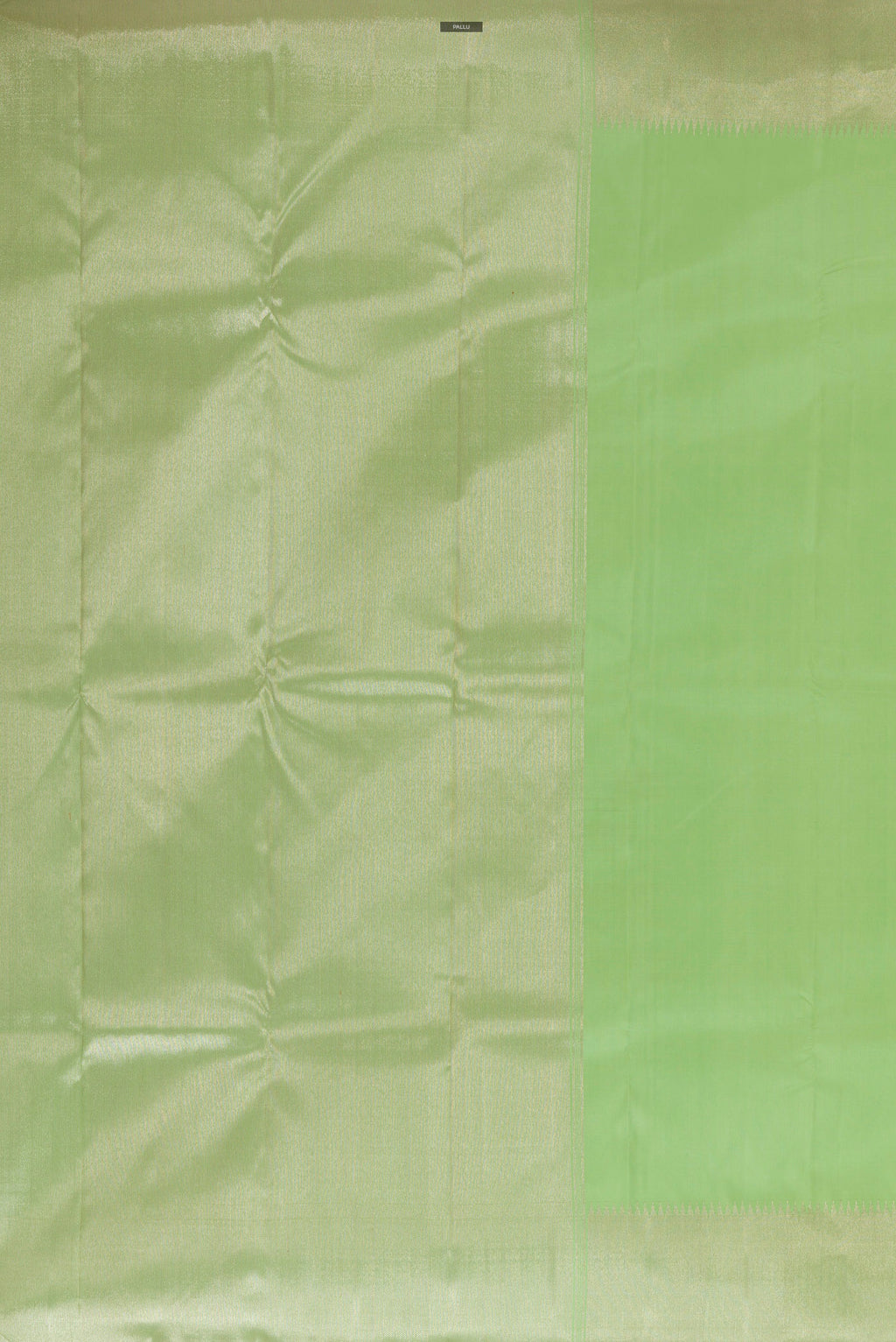 Close up image of the pallu of Pure Silk Pista Green Kanchipuram Saree with Plain Body and Zari Border. 