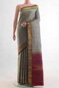 Pure Silk Grey Kanchipuram Saree with Stripes on the body and Zari Border.  displayed on a mannequin