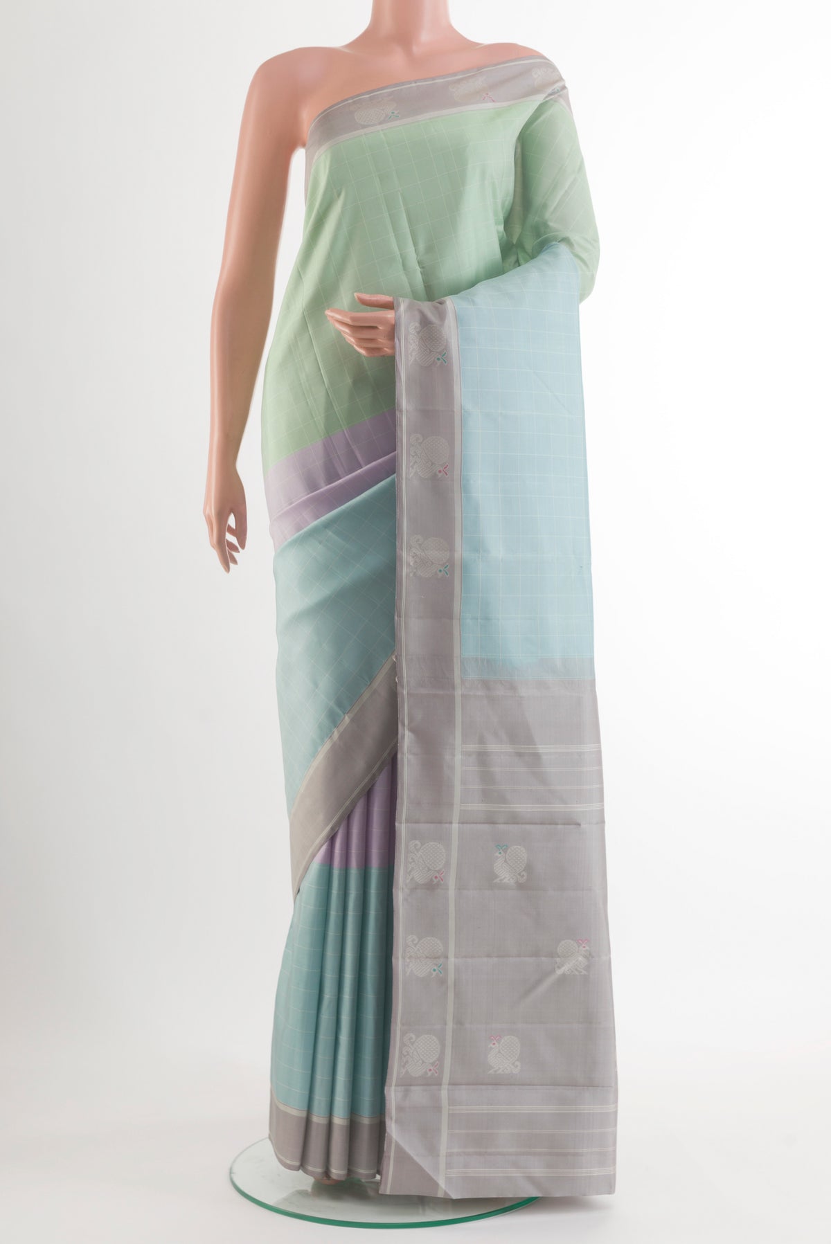 Pure Silk Multi Color Kanjivaram Saree with Checked design on the body and Plain Border.  displayed on a mannequin