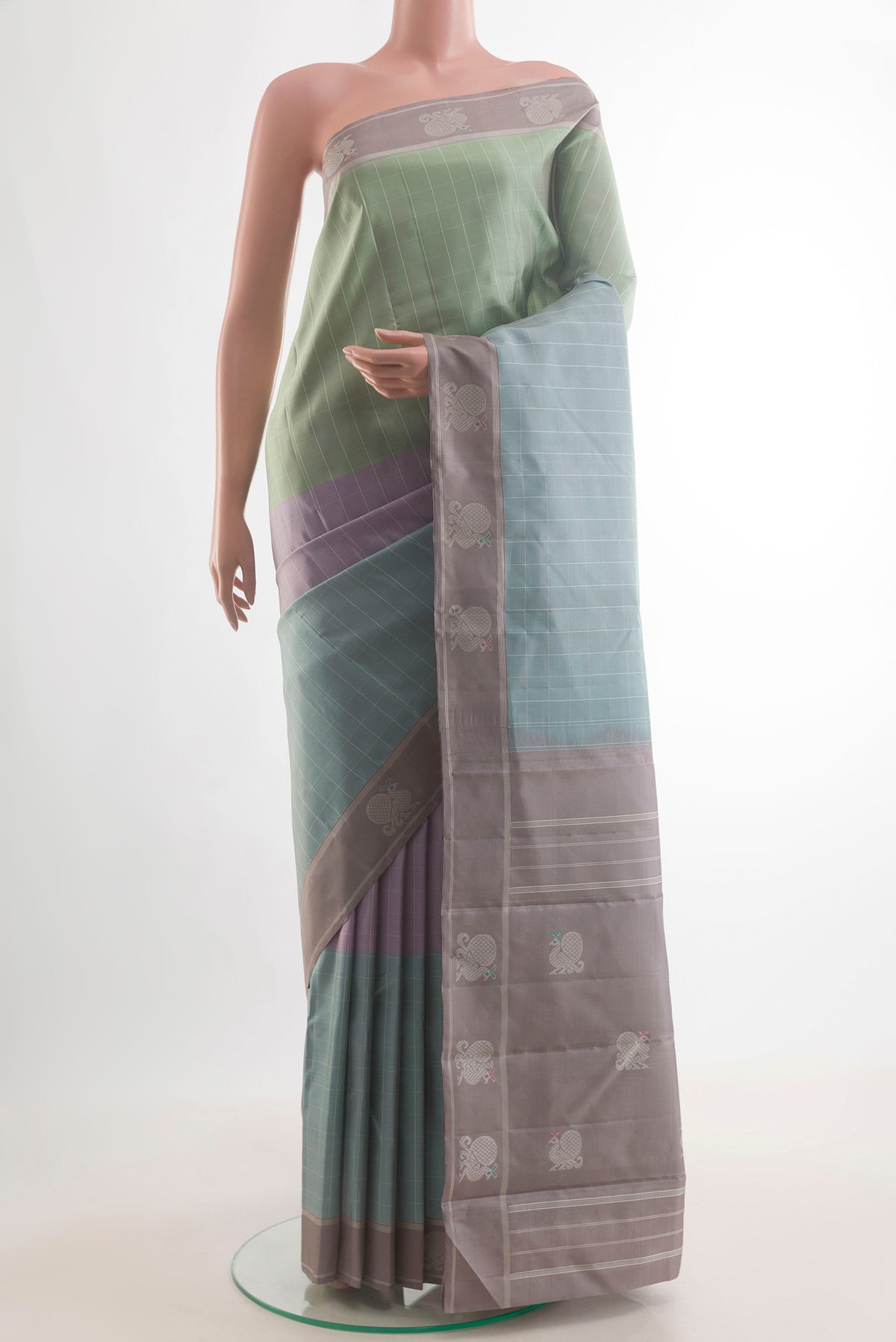 Pure Silk Multi Color Kanjivaram Saree with Checked design on the body and Zari Border.  displayed on a mannequin