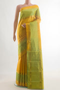 Pure Silk Yellow Kanjivaram Saree with Zari Butta on the body and Zari Border.  displayed on a mannequin
