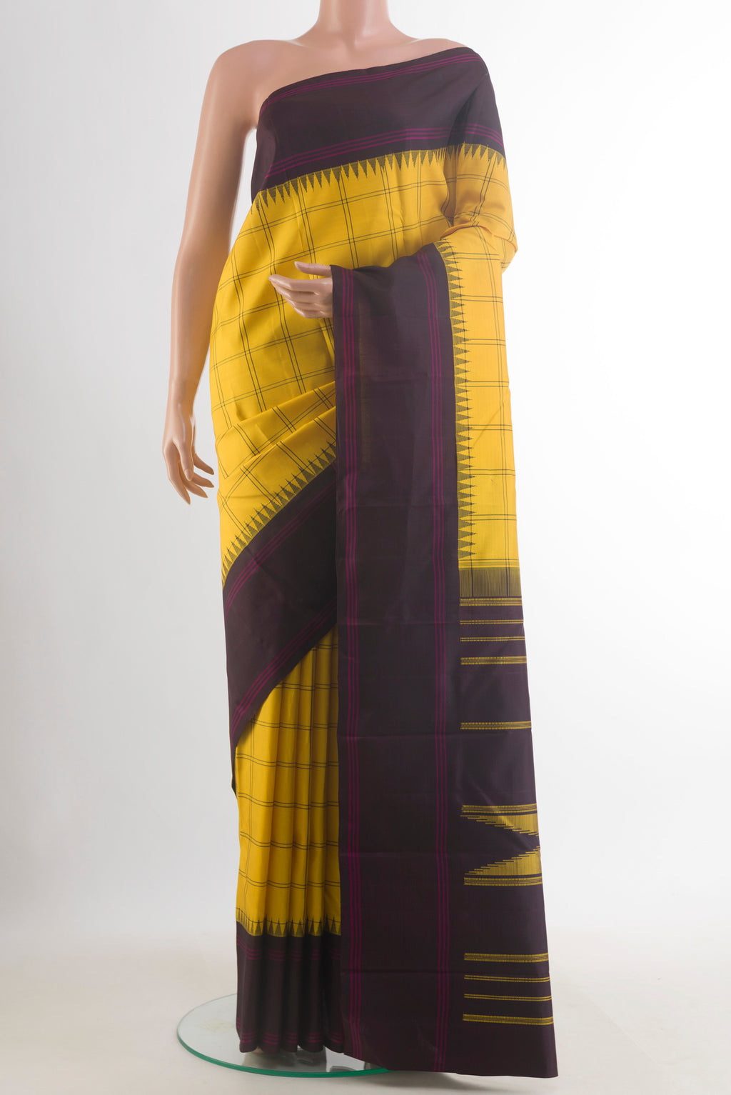 Pure Silk Yellow Kanjivaram Saree with Checked design on the body and Plain Border.  displayed on a mannequin