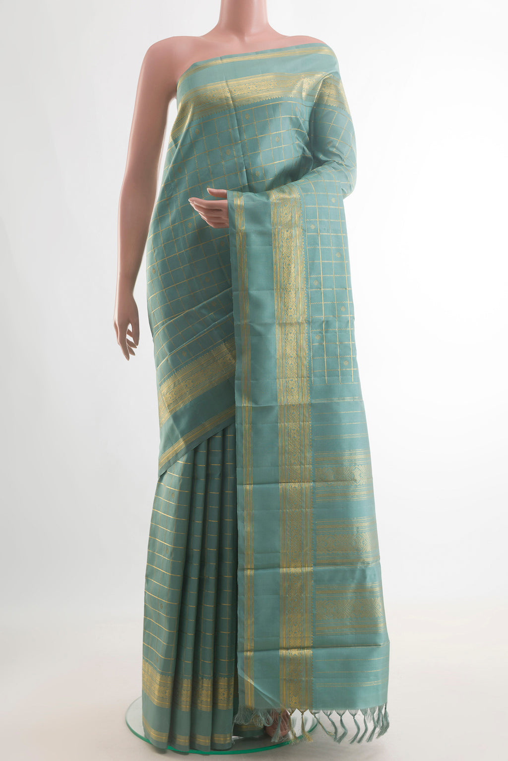 Pure Silk Sea Green Kanjivaram Saree with Checked design on the body and Zari Border.  displayed on a mannequin
