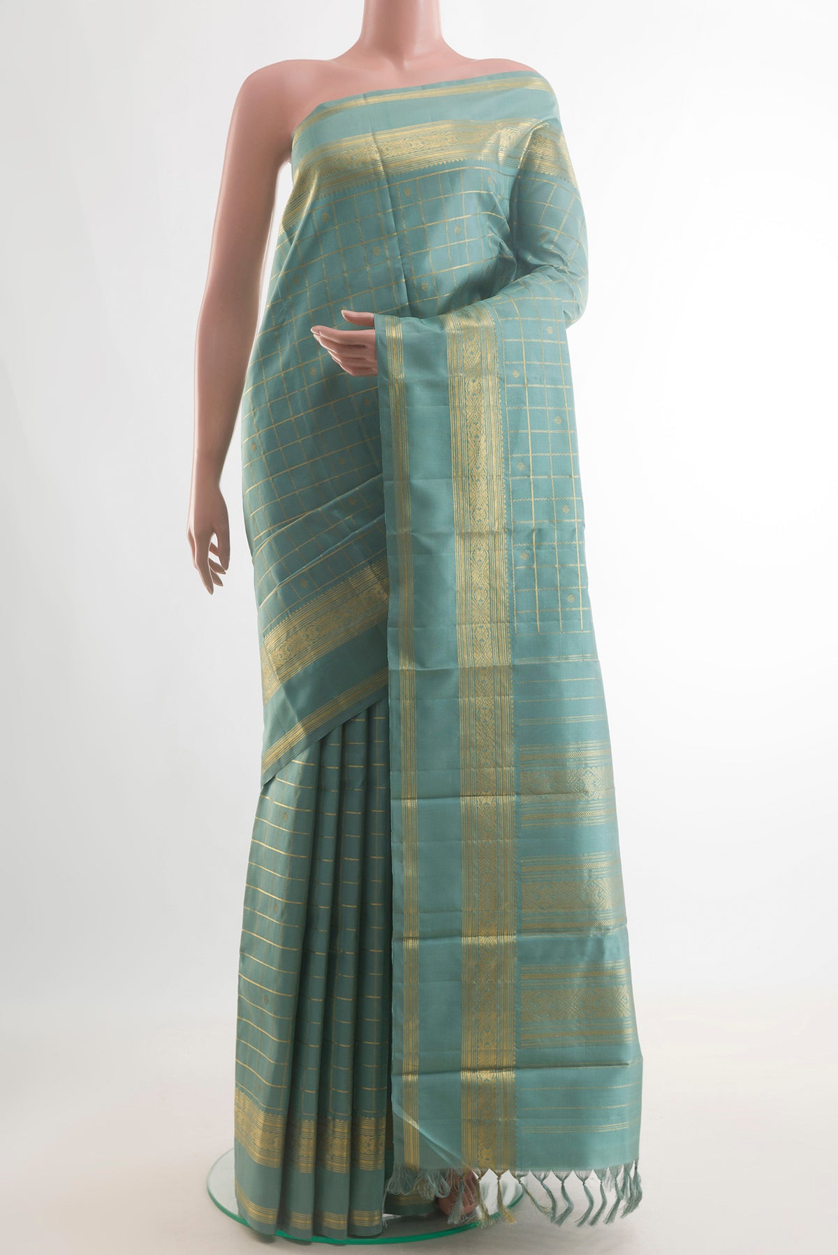 Pure Silk Sea Green Kanjivaram Saree with Checked design on the body and Zari Border.  displayed on a mannequin