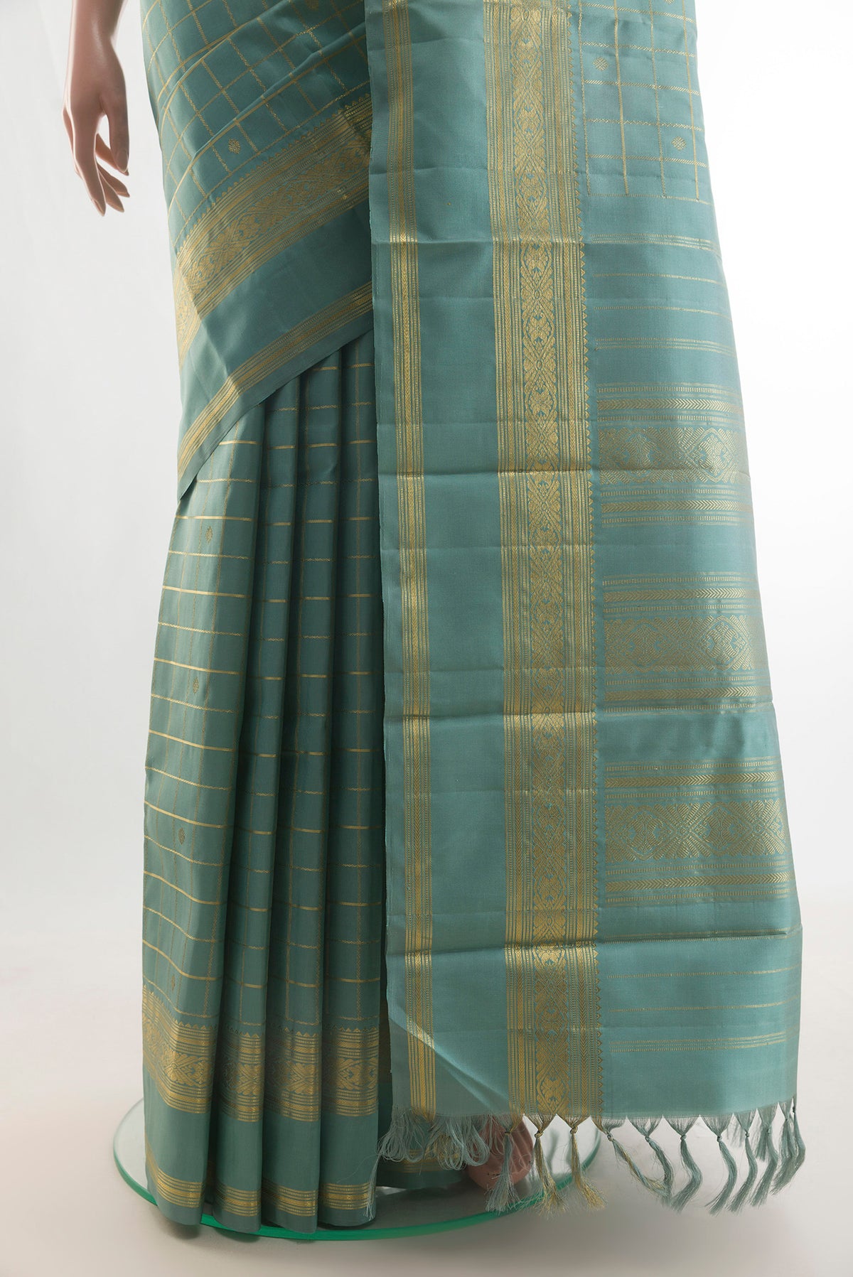 Pleats and pallu of Pure Silk Sea Green Kanjivaram Saree with Checked design on the body and Zari Border. 