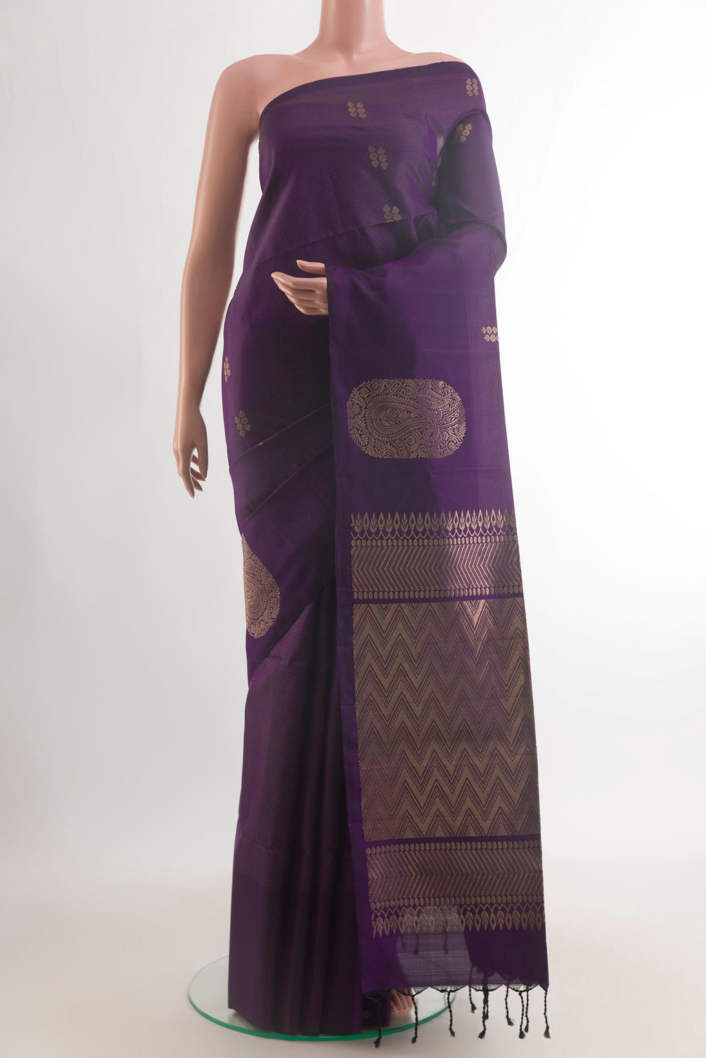Pure Silk Purple Soft Saree with Zari Butta on the body and Without Border.  displayed on a mannequin