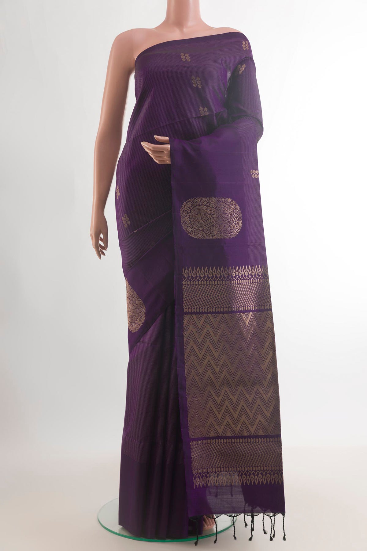 Pure Silk Purple Soft Saree with Zari Butta on the body and Without Border.  displayed on a mannequin