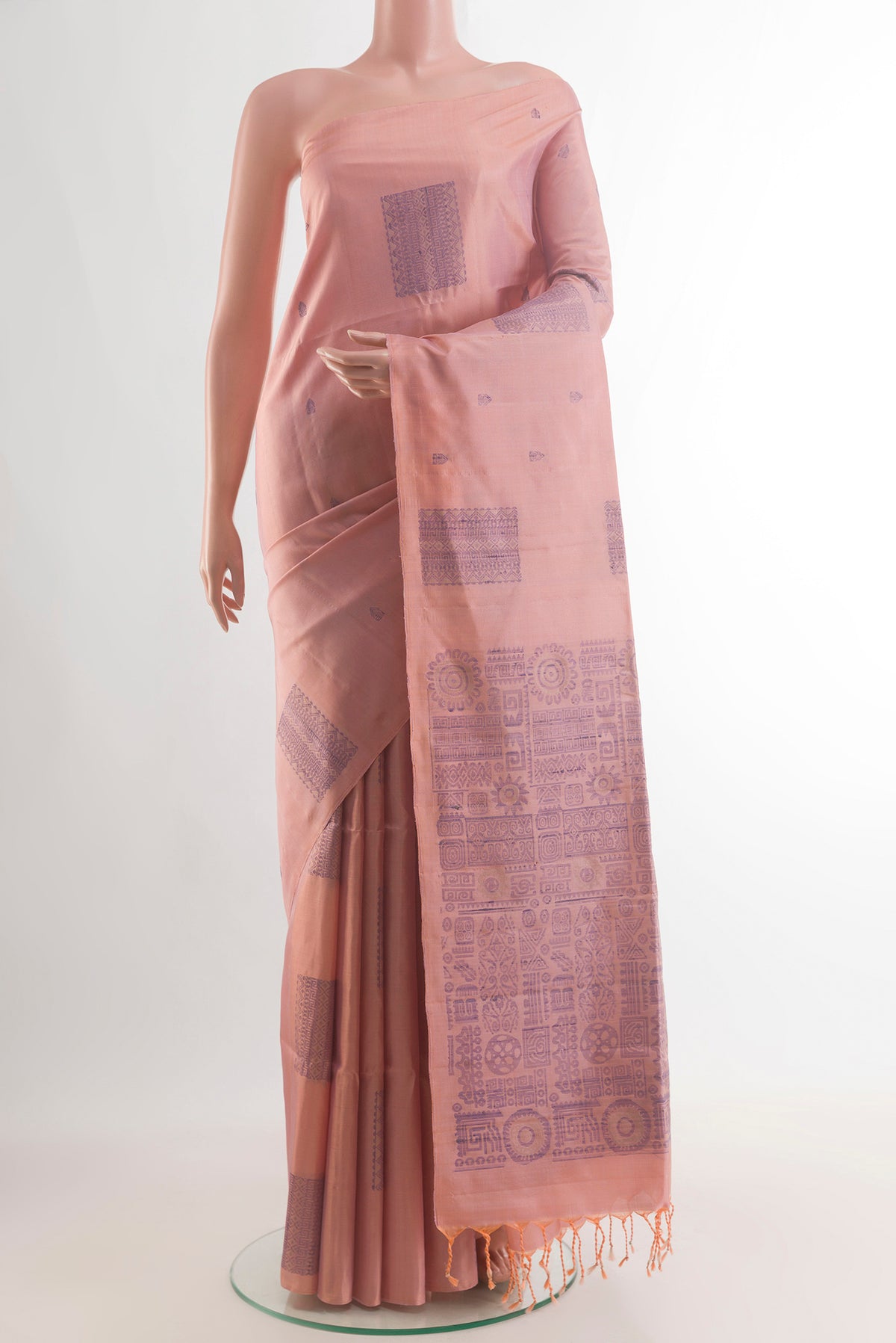 Pure Silk Peach Soft Saree with Thread Butta on the body and Without Border.  displayed on a mannequin
