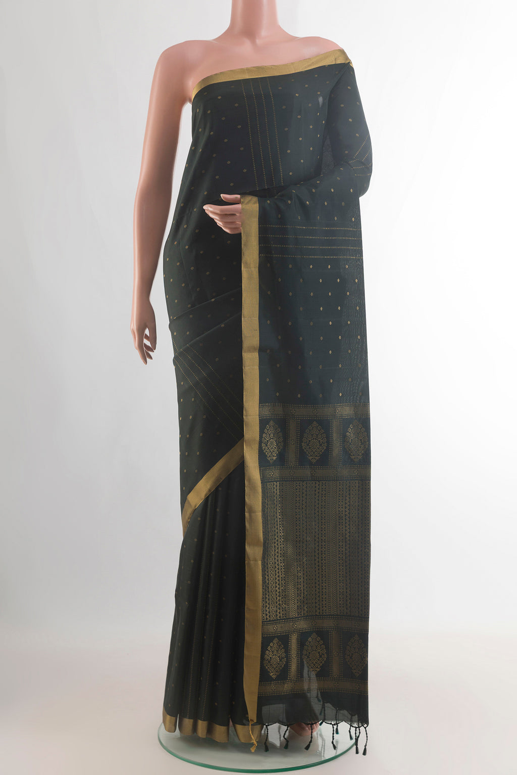 Pure Silk Black Soft Saree with Zari Butta on the body and Zari Border.  displayed on a mannequin