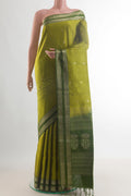 Pure Silk Green Soft Saree with Zari Butta on the body and Zari Border.  displayed on a mannequin